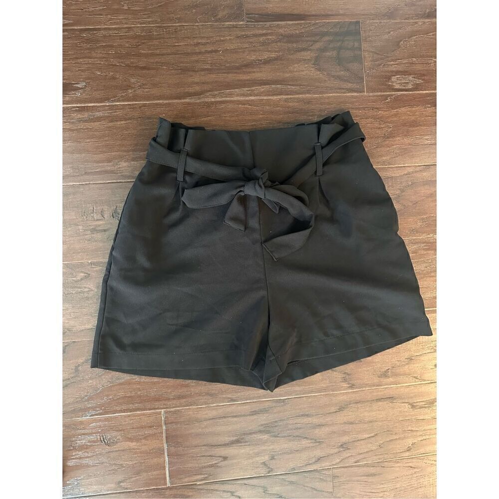 Have black paperbag back tie front shorts. Size lar